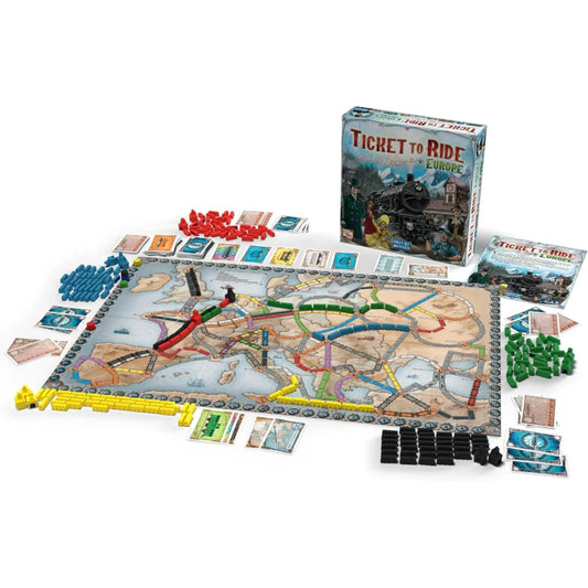 Ticket to Ride Europe board game setup showing the map of Europe covered in colorful plastic train pieces and cards.